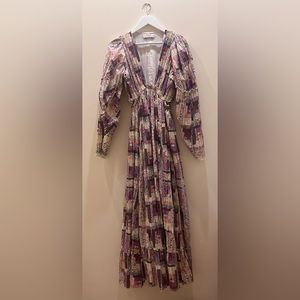 Naya Pleated dress with cutouts at waist.